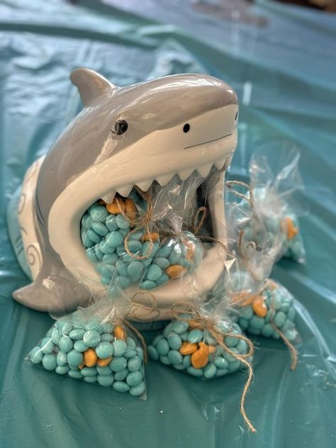 Shark Week All Year Long | My shark from Oriental Trading Company holding “fishbowls” for my grandkids | Facebook Shark Birthday Party Centerpieces, Sharks Birthday Party Ideas, Shark Decorations Party, Girl Shark Birthday Party, Shark Centerpiece Ideas, Shark Week Party, Pet Shark, Underwater Party, Shark Decor