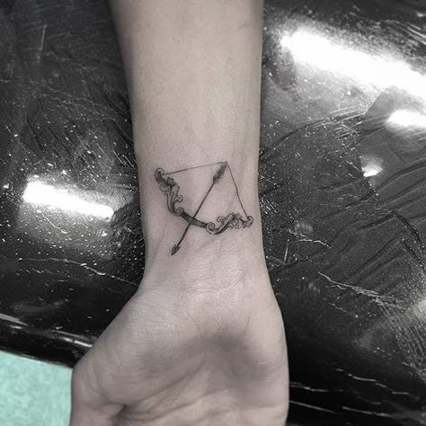 Bow and arrow micro tattoo by Isaiah Negrete. #IsaiahNegrete #blackandgrey #fineline #microtattoo #bow #arrow Bow Arrow Tattoos, Artemis Tattoo, Taekook Au, Micro Tattoo, Sagittarius Tattoo, Framed Tattoo, Forearm Band Tattoos, Bow Tattoo, Bow Arrow