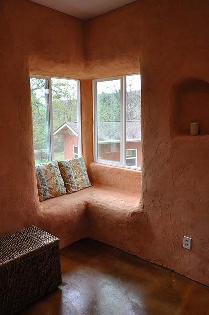 window seat    Strawbale construction: 3 times the insulation value of a conventional wall; 3 times more fire proof than a conventional home (yes, you read that right!); lessens pollution by using a waste material that normally contributes significantly to the pollution cycle; ideal building system for the owner builder; incredibly sound proof; able to withstand natural disasters Cob Home, Cob Building, Cob Homes, Casa Hobbit, Straw Bale House, Earthship Home, Mud House, Natural Homes, Straw Bale