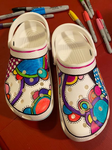 Had fun drawing on my crocs with sharpies! Side note: DO NOT spray with clear coat because the color will flake off. Sharpies do stain so it was easy to fix. Painted Crocs, Crocs Aesthetic, Shoes Pictures, Crocs Ideas, Cool Slides, Custom Crocs, Crocs Fashion, Colored Shoes, Custom Shoes Diy