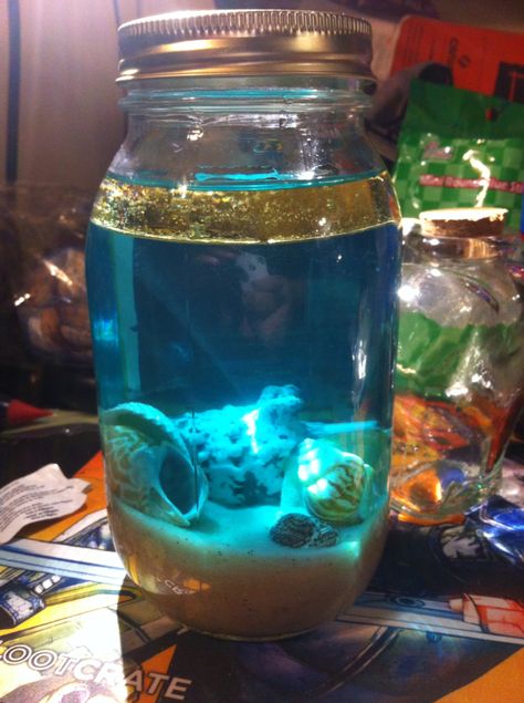 Moon tide ocean jar. #wiccanart #wicca #oceanmagic Mason Jar Art Ideas, Ocean In Bottle, Diy Ocean In A Bottle, Ocean In A Jar, Mermaid In A Jar, Ocean In A Bottle, Planted Aquatic Jar, Ocean Bottle, Anchor Theme