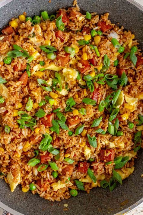 This spam fried rice recipe is a quick and easy dish that is perfect for using leftover rice! Loaded with crispy cubed spam, onions, garlic, corn, peas, and scrambled eggs, this recipe will always hit the spot! It's an effortless meal to whip up when you don't know what to make for dinner. Cooked Rice Recipes Leftover, Spam Fried Rice Recipe, Using Leftover Rice, Garlic Corn, Cooked Rice Recipes, Quick Fried Rice, Airfryer Breakfast, Spam Fried Rice, Teriyaki Rice