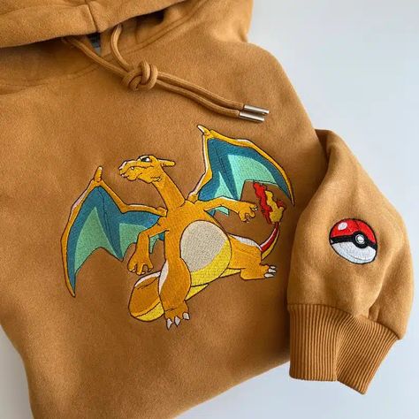 Pokemon Gifts For Adults | Pokemon | Pokemon Gifts | Pokemon Presents | Unique Pokemon Gifts | Unique Pokemon Presents | Creative Pokemon Gifts | Thoughtful Pokemon Gifts | Fun Pokemon Presents | #gifts #giftguide #creative #unique #pokemon Embroidery Pokemon, Pokemon Dragonite, Pokemon Embroidery, Pokemon Fabric, Pokemon Hoodie, Pokemon Charizard, Egirl Outfits, Pokemon Gifts, Anime Sweatshirt