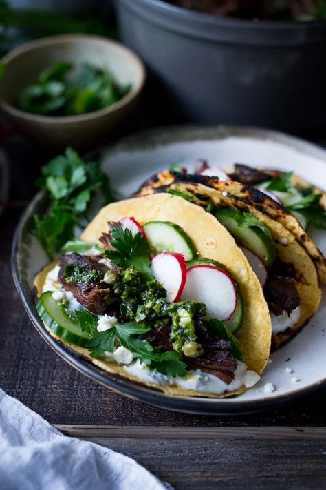 Greek Lamb Tacos with Tzatziki Sauce, cucumber and radishes. A Made with tender, falling off the bone, slow-roasted Lamb shoulder. Delicious flavors! #lamb #lambtacos #lambshoulder #slowroasted #braisedlamb www.feastingathome.com Greek Style Lamb, Lamb Tacos, Braised Lamb Shoulder, Lamb Taco, Slow Roasted Lamb Shoulder, Feasting At Home, Greek Lamb, Slow Roast Lamb, Braised Lamb