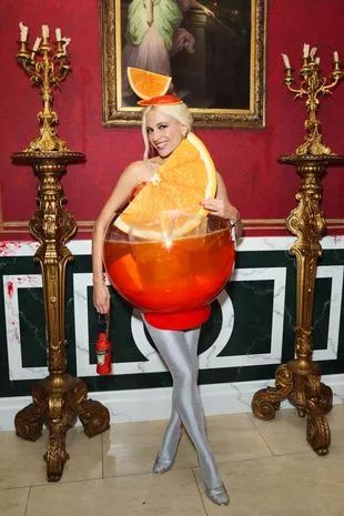 Pixie Lott wins Halloween with Aperol Spritz costume– here's how to copy her clever outfit - Mirror Online Aperol Spritz Kostüm, Kid Friendly Party, Bambi Dress, Best Celebrity Halloween Costumes, Annual Halloween Party, Celebrity Halloween, Pixie Lott, Celebrity Halloween Costumes, Halle Bailey