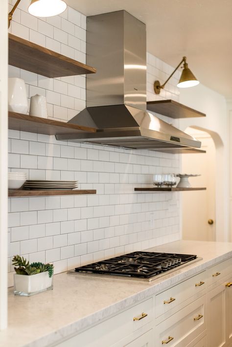 The key to floating shelves is a simple full wall ceramic tile backsplash to give a stage for your favorite bits and "often uses." Simply beautiful! #whytile Portfolio – Sacramento Interior Design | Aimee Hernandez Design Kitchen Tiles Wall Backsplash Ideas Open Shelving, Tile Backsplash With Floating Shelves, Full Wall Tile Kitchen, Full Tiled Wall Kitchen, Kitchen Full Wall Tile, Kitchen Stove Wall, Full Wall Kitchen Tile, Floating Shelves On Range Wall, Full Wall Kitchen Backsplash