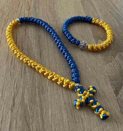 Rosary (50 knot rosary) and handmade bracelet "Glory to Ukraine". Bracelet made of thread in the colors of the Ukrainian flag. We make to order within 5 days. The price is per set. Ukrainian Bracelet, Ukraine Bracelet, Knotted Rosary, Ukrainian Flag, Handmade Bracelet, Prayer Beads, Rosary, Handmade Bracelets, Bracelet Making