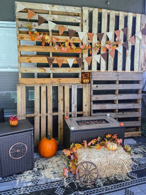 Found pallets at the schools me and my husband work at. Flag banner & other decorations from Temu. Hay bale from Amazon Tiger stripe pumpkin from Southern Hills Farm Regular pumpkin from Target Farm Photo Booth, Pallet Photo Backdrop, Pumpkin Paint, Fall Pallets, Fall Backdrops, Me And My Husband, Painted Backdrops, Pumpkin Farm, Farm Photo