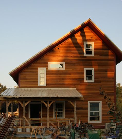 The view from the west reveals the shape of the saltbox roof. Saltbox Roof, Saltbox House Plans, Salt Box House, Saltbox Houses, Shed Building Plans, Cedar Siding, Sunset Light, Passive Solar, Salt Box