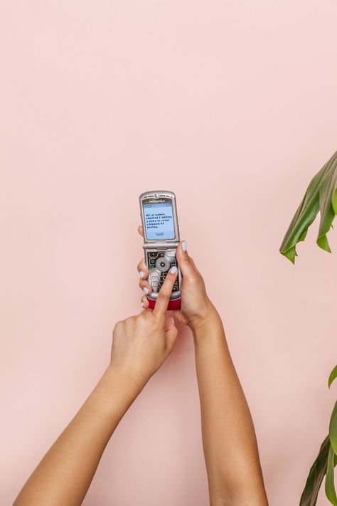 hands holding a phone with text. Download this photo by Curology on Unsplash Phone Texting, Holding Phone, Teen Wallpaper, Phone Photo, Map Marker, Hands Holding, Flip Phone, White Crew Neck, Public Domain Images