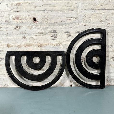 Two Modern vibe vintage Stove Trivets. Made of cast iron with enamel, black shiny fronts, slightly rusty on backs. 8" x 5" . . . #vintage #trivet #unusual #object #useful #curiousobjects #functional #neccessaryobject #hattiemaudevintage #modern #curved #black #stove #americana #unusualcollection #wants #needs #necessaryobjects #collection #antique #curiousobject #metal #castiron Vintage Trivet, Black Stove, Vintage Stove, Vibe Vintage, Vintage Stoves, Modern Vibe, Trivets, Art Object, Stove