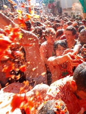 Private tour companies sell tickets and accommodation in the nearby city of Valencia. Those willing to spend more can buy a coveted space on the back of the trucks that carry the tomatoes to the town, for an additional fee of €750. Photograph: Alberto Saiz/AP Bunol Spain, Tomatina Festival, La Tomatina Festival, Tomato Festival, I Dream Of Genie, La Tomatina, Spanish Towns, Mercer Island, Red Pictures