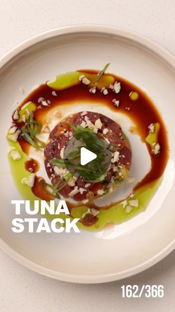 Michael Tchao on Instagram: "Tuna Stack [Recipe 👇🏻] 

This simple recipe is super quick and easy to put together but is also a great dish to impress your guests this summer. It’s inspired by one of my fave appies at Cactus Club - the Tuna Stack!

Herb oil Ingredients:
- 1 bunch parsley
- 2 scallions
- 1/2 cup of avocado oil

Method: 
1) blend all together in a blender. Add more oil if needed till everything is combing and smooth
2) transfer to a pot and cook oil for about 5 minutes to infuse the oil. Then cool pot in an ice bath.
3) once cooled, strain through a coffee filter and set aside 

Tuna Stack Ingredients:
- 250g ahi tuna, cubed 
- 2 Tbsp less sodium tamari @sanjtamari
- orange segments
- 1 Tbsp Sesame Oil
- 1 Tsp Rice Vinegar
- .5 Tsp Zested Ginger
- 2 Green Onions - white part Tuna Stack Recipe, Ahi Tuna Sauce, Tuna Stack, Ahi Tuna Recipe, Cactus Club, Herb Oil, Ice Bath, Ahi Tuna, Black Sesame Seeds