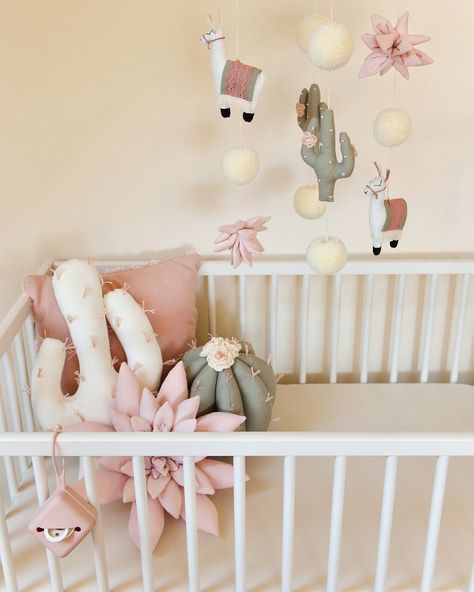 Available to order again 😍! Elevate your #nurserydecor with our lovingly #handcrafted Pom Pom Paradise Nursery Mobile & matching decor pillows. This charming mobile features an enchanting mix of adorable llamas, elegant ivory pom poms, lush pastel pink succulents and #sagegreen cacti, creating a delightful and serene environment for your little one. Share with your friends today 🥰 #shopsmall #nurseryinspo Llama Nursery Theme, Llama Themed Nursery, Pink Succulents, Succulent Nursery, Llama Nursery, Serene Environment, Baby Room Inspiration, Nursery Theme, Nursery Inspo