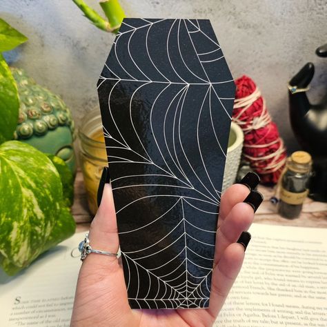 📚🖤 Rest in pages, not in peace! 🖤📚 Elevate your reading game with our unique coffin bookmark—perfect for bookworms who live for the spooky vibe. Each hand-designed piece adds a touch of mystery to your favorite reads! 🕸️✨ #BookmarkGoals #SpookySeasonReady #HandcraftedMagic #MinkasMotifs #CraftingMagic #HandmadeWithLove #SmallBusinessVibes Coffin Bookmark, Clay Inspo, Reading Games, In Peace, Art Market, Book Worms, Reading, Quick Saves, Art