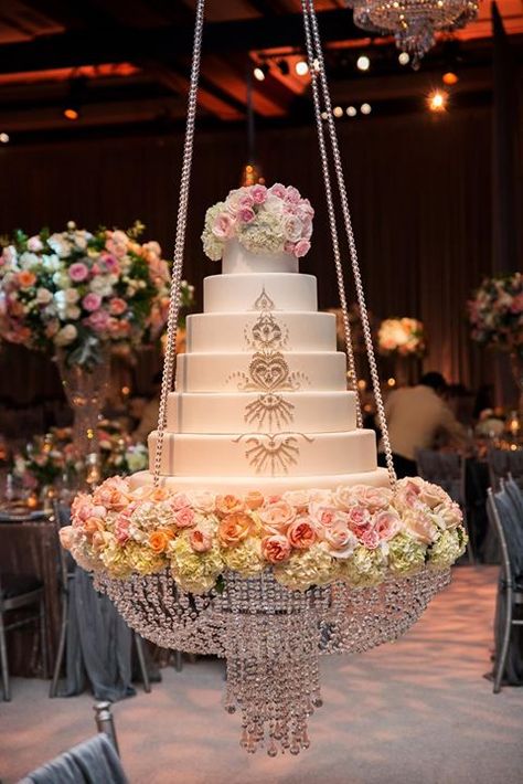 For a spectacular look, a wedding cake was suspended from the ceiling by crystal chains creating a striking chandelier ~ http://homemadehooplah.com/recipes/no-bake-pink-lemonade-cheesecake-parfaits/ Suspended Wedding Cake, Hanging Cake, Chandelier Cake Stand, Extravagant Wedding Cakes, Chandelier Cake, Cake Stand Decor, Jewish Wedding Ceremony, Wedding Ceremony Ideas, Cake Flower