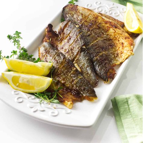 Miso Baked Branzino is a healthy, easy, and delicious dish that will please seafood lovers of all ages. This dish is perfect for a weeknight meal because it only takes minutes to prepare and the oven does all the work! The Branzino is glazed with a miso sauce which gives it a wonderful depth of flavor. Bronzino Recipe, Baked Branzino Recipe, Bronzino Fish Recipe, Baked Branzino, Branzino Recipe, Filet Recipes, Miso Sauce, Oven Roasted Asparagus, 30 Minute Meals Easy