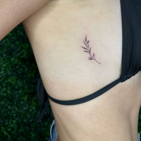 Little olive tree branch 🫒 her first tattoo! For appointments please fill out the booking form on www.kattitudetattoo.com . . . #atx#atxlife#austin#austintexas#atxtattoosaustin#atxtattooaustin#tattooatx#tattoosatx#singleneedletattooaustin#singleneedletattoosaustin##smalltattoosaustin#smalltattooaustin#smalltattooatx#smalltattoosatx#flowertattoosaustin#flowertattooaustin#flowertattoosatx#finelinetattooatx#finelinetattoosatx#finelinetattooaustin#finelinetattoosaustin#stickertattoosaustin#st... Olive Flower Tattoo, Olive Tattoo Design, Dove Olive Branch Tattoo, Fig Branch Tattoo, Small Olive Branch Tattoo, Fine Line Olive Branch Tattoo, Tattoos Mum, Dove With Olive Branch Tattoo, Olive Branch Sketch