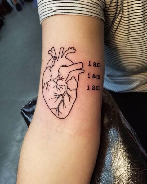 This is a wonderfully simple tattoo that can be perfect to instill self-belief in girls. The words “I am” iterated three times can act as a great motivational tool while the heart itself is subtly beautiful and is able to achieve a lot without taking up too much space. #tattoofriday #tattoos #tattooart #tattoodesign #tattooidea Real Heart Tattoos, Human Heart Tattoo, Realistic Heart Tattoo, Anatomical Tattoos, Heart Tattoo Ideas, Anatomy Tattoo, Red Heart Tattoos, Tattoos Black Women, Anatomical Heart Tattoo