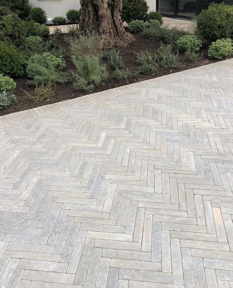 Exquisite Surfaces | Particularly dynamic in a herringbone pattern, the newest offering in our Cobblestone collection, Meknes Tumbled Pavers, creates a stunning… | Instagram Exquisite Surfaces, Driveway Installation, Limestone Pavers, Paving Pattern, Limestone Paving, Outdoor Pavers, Paving Ideas, Paver Designs, Driveway Paving