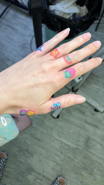 Tattoo Cute on Instagram: "Finger tats! My new favorite thing. Come get some! ✨🌟🌈💖🌸🍓. #fingertattoo #fingertattoos #kawaiitattoo #kawaiitattoos #cutetattoo #cutetattoos #colorfultattoo" Finger Tattoos Colorful, Kawaii Finger Tattoo, Hand Tattoos Colorful, Colorful Finger Tattoo, Color Finger Tattoo, Anime Finger Tattoos, Hand Tattoo Color, Colorful Hand Tattoos, Tattoo Fingers