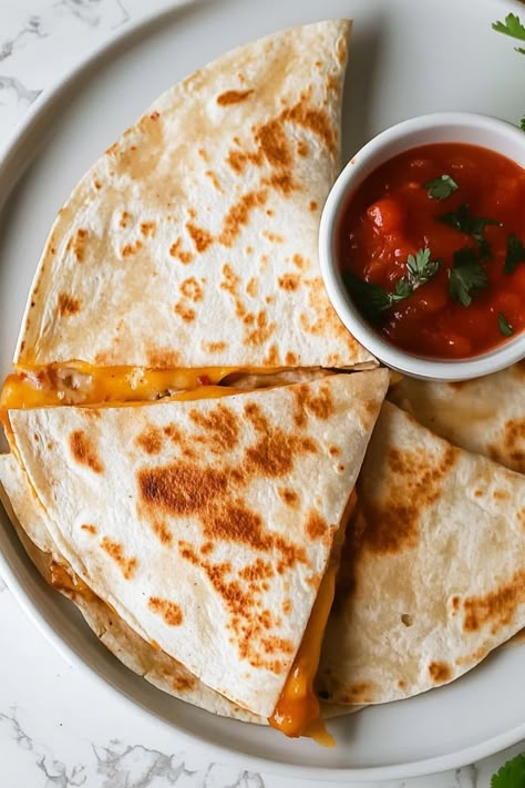 Meals don't get much easier than these tasty cheese quesadillas! With just four ingredients, they're simple, quick, and sure to please. Mini Quesadillas Appetizers, Quesidias Recipes, Ham And Cheese Quesadilla, Quesadilla Cheese, Quesadillas Recipes, Cheese Quesadilla Recipe, Easy Quesadilla, Cheese Quesadillas, Eating At Home