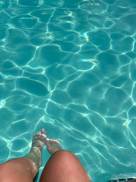 sitting on the edge of the pool with feet in the blue water at a resort on vacation Resort Aesthetic Pool, Sitting By The Pool Aesthetic, By The Pool, Reading By The Pool, Summer Bucket List 2023, Sitting By The Pool, Inside Pool, Pool Aesthetic, Turkey Holiday