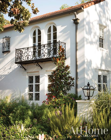 Inspired by California and its Spanish Colonial architecture, landscape designer Chris H. Olsen gives an iconic North Little Rock home a much-needed exterior update // Arkansas home Colonial Renovation, Spanish Exterior, Boho Glam Home, Spanish Colonial Homes, Spanish Revival Home, Landscaping Inspiration, Iron Balcony, Mediterranean Home Decor, Spanish Architecture