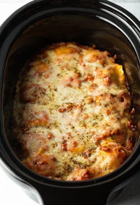 Ravioli lasagna cooked in a slow cooker. Slow Cooker Lasagna Casserole, Crockpot Ravioli Lasagna, Slow Cooker Ravioli Lasagna, Slow Cooker Ravioli, Crockpot Ravioli, Crock Pot Lasagna Recipe, Ravioli Lasagna, Slow Cooker Casserole, Lasagna Casserole