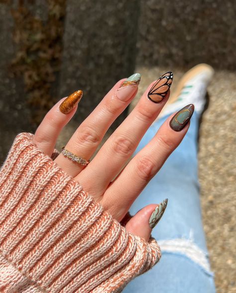 fall mix & match 🍂🙂‍↕️ @lightslacquer cold turkey, mrs robinson, & espresso @mooncat bootlegger literally can’t stop adding 3d gel to nail looks, it really elevates everything!! this might be one of my fav looks i have created in a while, inspo came from pinterest 🦋🫶🏼🍂 Fall Nails Blooming Gel, Winter Butterfly Nails, Neutral Butterfly Nails, Butterfly Fall Nails, Metallic Butterfly Nails, Espresso Nails, Monarch Nails, Mrs Robinson, Elegant Nail