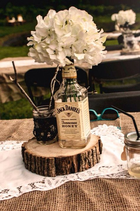 Tennessee honey Jack Daniels hydrangea rustic wedding center piece  -MJD Biker Wedding, Jack Daniels Bottle, Rustic Wedding Decorations, Bottle Centerpieces, Rustic Wedding Signs, Rustic Centerpieces, Rustic Wedding Centerpieces, Marriage Ceremony, Cozy Chic