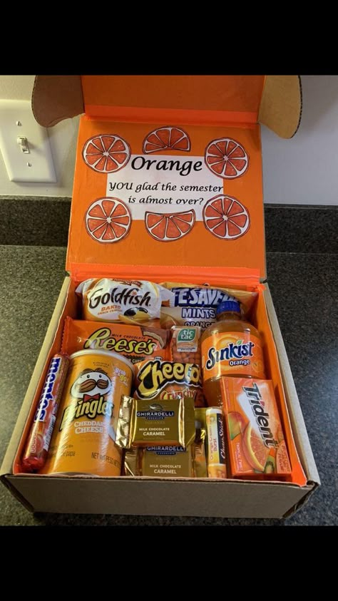 Orange Gift Box Ideas, Orange Gift Basket, Care Packages For College Students, Orange Gift Box, College Gift Baskets, College Dorm Gifts, College Snacks, Snack Gift Baskets, Graduate High School