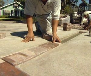 How to Install Pavers Over a Concrete Patio Without Mortar | Today's Homeowner Pavers Over Concrete Patio, Pavers Over Concrete, How To Lay Pavers, Belgard Pavers, Outdoor Yard Ideas, Concrete Dye, Build Outdoor Furniture, How To Install Pavers, Paving Ideas