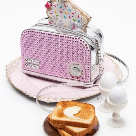 Betsey Johnson Kitsch Get Toasted Pink Crossbody Bag *2 Piece Set* Bj34510m "We Sell To Collectors" Brand New In Sealed Package With Tags It's Time To Get Toasty! And What Better Way Than With This Decked-Out Toaster-Shaped Crossbody Bag. It's The Perfect Way To Make A Retro Statement When You're Out And About! Heading To A '90s-Themed Party? Make It A Set By Pairing It With The Pop Tart Change Purse. Manmade Materials With Rhinestones 8.5"L X 4"D X 5.5"H Imported Style Name: Bj34510m Pink Toaster, Betsy Johnson Bags, Novelty Purses, Betsey Johnson Purses, Pop Tart, Unique Backpacks, Cream Bags, Popular Handbags, Pink Crossbody Bag