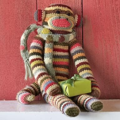 A colorful knitted Sock Monkey  bearing gifts.   Knitted woodland creatures  wearing scarves and hats.  Knitting Patterns here .   100% Chr... Monkey Teddy, Crochet Sock Monkeys, Monkey Crochet, Sundance Jewelry Catalog, Crochet Monkey, Sock Monkeys, Unique Clothes For Women, Pet Monkey, Sock Animals