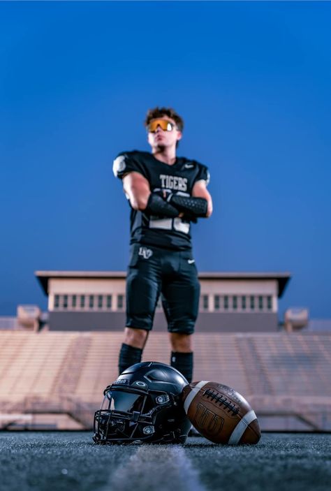 Senior Football Poses Photo Ideas, Senior Pictures With Football, Senior Pictures For Football Players, Football Pics Ideas, Kid Football Pictures, Football Senior Pic Ideas, Dramatic Football Pictures, High School Football Photography, Boys Sports Senior Picture Ideas