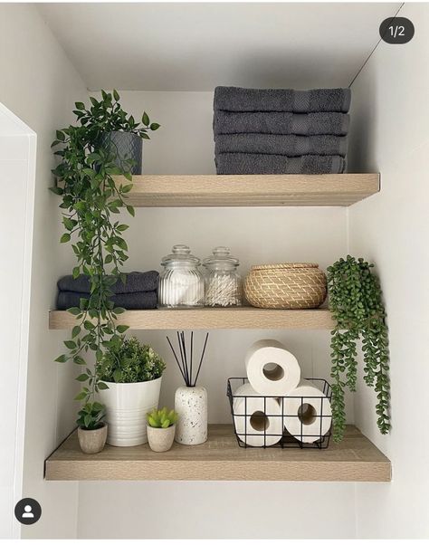 Bathroom Shelves On Wall, Cloakroom Toilet Storage Ideas, Towel Rack Styling, Minimalist Bathroom Shelves, Wc Shelf Ideas, Bathroom Shelf Inspiration, Spa Bathroom Shelf Decor, Bathroom Decor On Top Of Toilet, Bathroom Greenery Decor