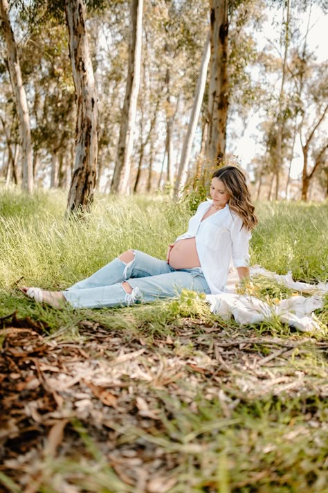 Mama poses in Eucalyptus trees with a white button up and jeans while showing off her cute baby bump Maternity Pictures White Button Up, Open Jeans Maternity Photos, Maternity Pictures Jeans White Shirt, Maternity Photo Shoot White Button Up, Maternity Photography Poses Mom Only, Maternity Pics Jeans, Maternity Photography With Jeans, Maternity Pics With Jeans, Button Up Maternity Photos