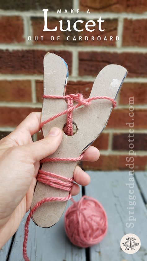 First person point of view of left hand holding two-tined lucet knitting tool made of cereal-box cardboard with partially completed cord wrapped around it. Tools For Knitting, Lucet Fork Projects, Viking Crafts For Kids, Lucet Projects, Viking Diy, Lucet Fork, Viking Weaving, Viking Knit Tutorial, Wild West Crafts