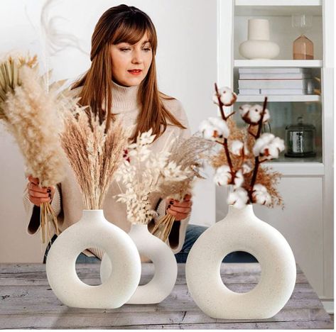 🌷【EXQUISITE MODERN DESIGN】– If you're tired of dull and unremarkable designs, you'll love these beautiful white ceramic vases with unique hollow designs for your home décor. 🌷�【AESTHETIC & FLAWLESS DETAILS】 – Each decorative vase for pampas grass is carefully designed and handcrafted with clean and elegant golden ratio lines. Fired at 1700 degrees, they are unique works of art. Donut Vase Decor, Neutral Modern Home, Wedding Party Room, Office Coffee Table, Donut Vase, Coffee Table Decor Ideas, Boho Vase, Plastic Vase, Flower Vases Decoration