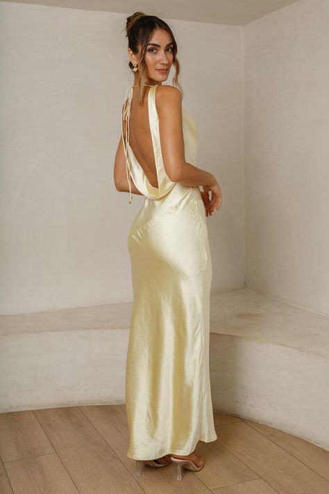 The Cassandra Open Back Maxi Dress features a stunning cowl neckline with an open back that ties. It has a zipper on the side. Runs true to sizeModel is 5'7" and wears a size XSMALLNot linedDesigned in AustraliaOur boutique is located in M... Long Open Back Dress, Yellow Formal Dress, Robes Glamour, Yellow Bridesmaid Dresses, Open Back Maxi Dress, Dresses Australia, Michigan Usa, Looks Party, Prom Dress Inspiration