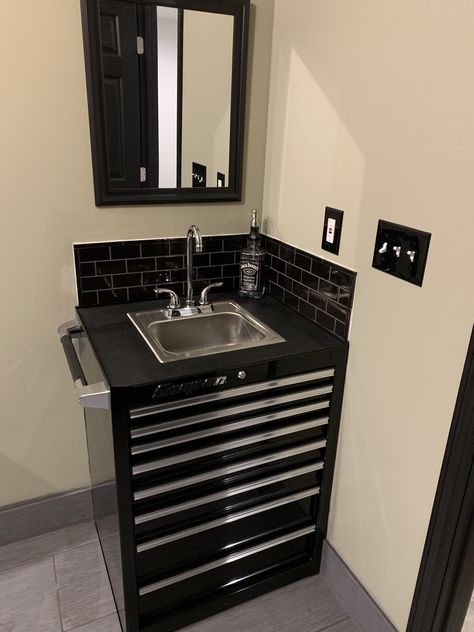 Toolbox sink with black subway tile and black grout🖤 Tool Box Sink Bathroom, Auto Shop Bathroom Ideas, Automotive Repair Shop Waiting Rooms, Race Car Bathroom Ideas, Shop Bathroom Ideas Garages, Mechanic Waiting Room Ideas, Mechanic Shop Design, Mechanic Bathroom, Toolbox Kitchen