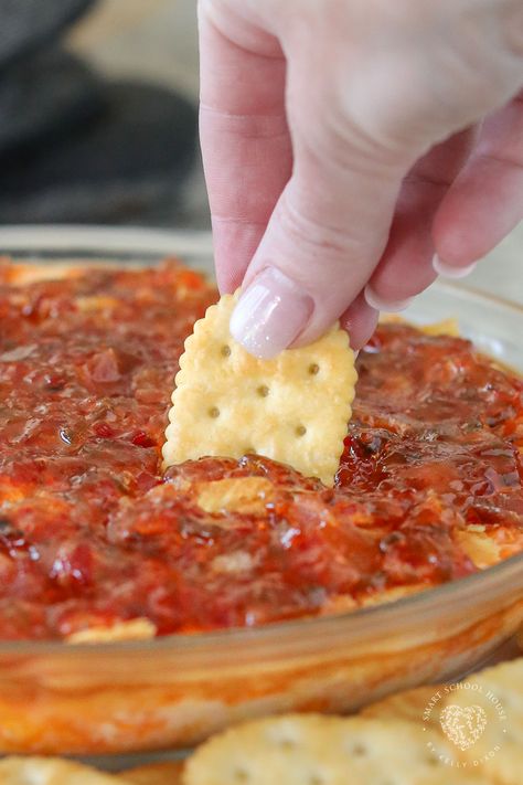 Pepper Jelly Cheese Dip is a warm appetizer served with butter crackers! This easy appetizer recipe uses simple ingredients that have the best flavor when combined. Valentine Party Dips, Red Pepper Jelly Dip Appetizer Recipes, Hot Jelly Cream Cheese Dip, Valentines Recipes Appetizers, Hot Pepper Jelly Cream Cheese Dip, Whipped Boursin And Pepper Jelly Dip, Jalapeno Jelly Cream Cheese Dip, Hot Pepper Jelly Cheese Dip, Baked Pepper Jelly Cheese Dip