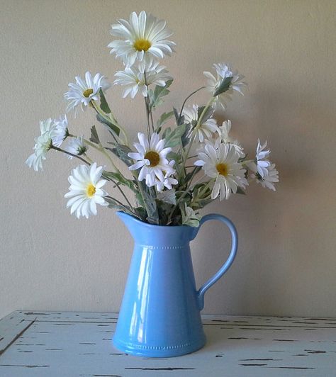 White Daisies in Blue Pitcher Blue Daisies Aesthetic, Vase Of Daisies, Flowers In Pitcher, Daisies In Vase, Daisy Arrangements, Magnolia Wedding Flowers, Daisies In A Vase, Daisy Kitchen, Eclectic Paintings