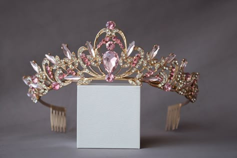 A small and delicate pink crown. The crown is perfect for both children and adults due to its small size and weight. Beautiful sparkling tiara with pink crystals in gold or silver plated. Incredible tiara that will look great on the bride. I'm sure you will get a lot of compliments.  Height of the tiara - 2"( 5 см) Features: Tiara made with pink crystals and rhinestones Sturdy metal frame Delicate crystal pattern Care instructions: Avoid contact with water Clean with a soft cloth Store in a cool Crystal Wedding Crown, Pink Tiara, Wedding Tiara Veil, Tiara Silver, Crystal Crown Wedding, Crown Birthday, Birthday Tiara, Crown Crystal, Crystal Bridal Tiaras