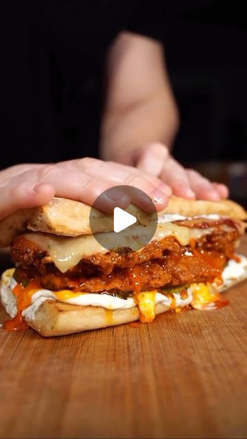 Food Mood Clips 😋 on Instagram: "BUFFALO CHICKEN SANDWICH RECIPE! Get ready to indulge in the ultimate comfort food - a crispy Buffalo Chicken Sandwich that’s sure to satisfy your cravings!🤤 This recipe features juicy @goodranchers chicken coated in a crunchy cornflake crust, drenched in homemade buffalo sauce, and topped with crispy bacon, melted pepper jack cheese, pickles, and a dollop of homemade ranch dressing.😍 Check out the recipe below and don’t forget to tag a friend who would love to try this mouthwatering sandwich!

Recipe: 

Chicken:
- Flour mixture: 1 cup all purpose flour, 1/2 tbsp garlic salt, 1/2 tbsp paprika, 1/4 tbsp cayenne pepper, 1/2 tsp pepper
- Egg mixture: 2 eggs, 1 cup buttermilk, 1 tbsp hot sauce
- Cornflake Dust

Directions:
1. Salt and pepper chicken
2. Dredg Crispy Buffalo Chicken Sandwich, Chicken Bacon Ranch Sandwich, Buffalo Chicken Sandwich, Dried Chives, Cheese Pickles, Chicken Sandwich Recipe, Dried Dill, Buffalo Chicken Sandwiches, Homemade Buffalo Sauce