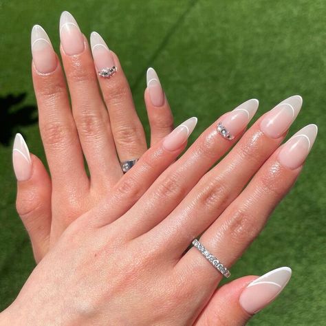 From embellished to simple, this classic option is always a good idea. Ombre Nails With French Outline, White Ombre Nails, French Tip Almond, Classic Nail Designs, White Almond Nails, Oval Nails Designs, Almond Nails French, Euphoria Nails, Elegant Touch Nails