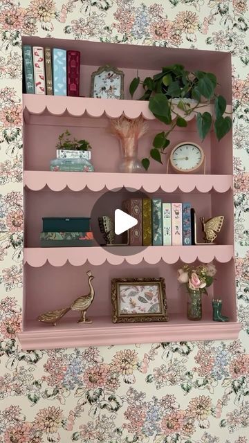 Michelle Hsu on Instagram: "This space looked so blank so I decided to add some personality to it with these scalloped shelves and wallpaper!

To me these shelves kind of make the space look like a dollhouse which I love!

I ALMOST left these shelves white because I liked the contrast, but ultimately decided to go with painting them pink. What would you have done? Kept them white or painted pink?

#beforeandafter #pinkdecor #myhousebeautiful #cozyhome #homeremodel" Girls Bookshelf Ideas, Wallpapered Bookshelf, Scalloped Shelves, Girls Bookshelf, Wallpaper Bookshelf, Scalloped Shelf, Pink Shelves, Styling Bookshelves, Peach Walls