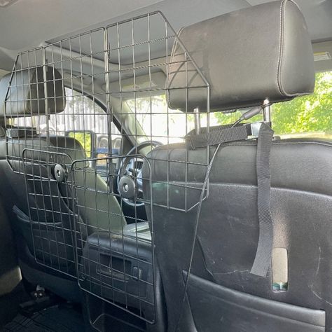 I recently bought this metal barrier for my truck to keep my Rottweilers in the back.  They like to ride shotgun and interfere with my driving.  This does a great job at keeping them in the back.  I highly recommend this product. Suv Dog Set Up, Dog Car Barrier, Dog Barrier, Dog Gadgets, Pet Barrier, Dog Gate, Dog Car, Diy Car, Gmc Trucks