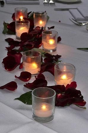 very simple way to decorate long tables. Candle And Petals Centerpiece, Rose Petals And Candles Centerpiece, Simple Red Rose Centerpiece, Rose Petals On Table, Rose Petals Wedding Table, Rose Petals Table Decor, 15 Decorations, Votive Centerpieces, Tiana Wedding